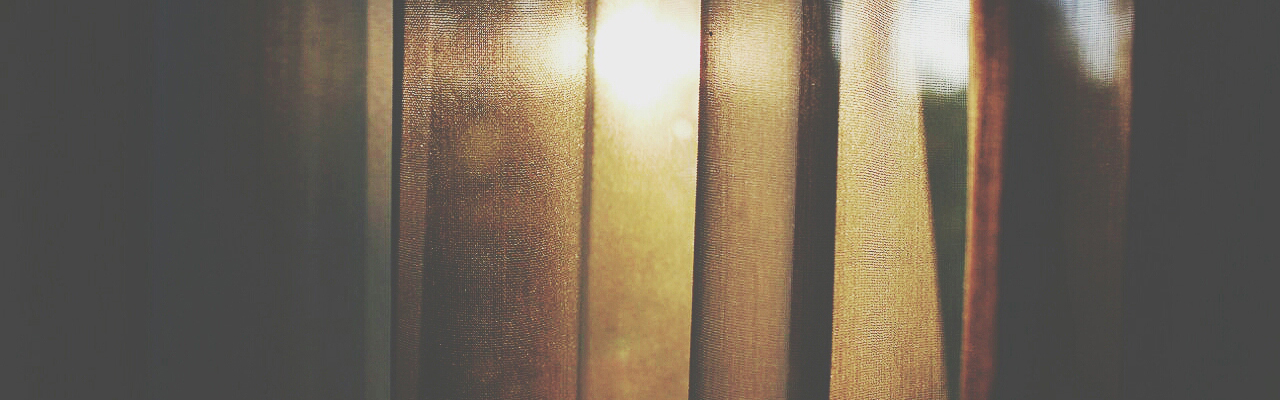 Yellow daylight thru a curtain