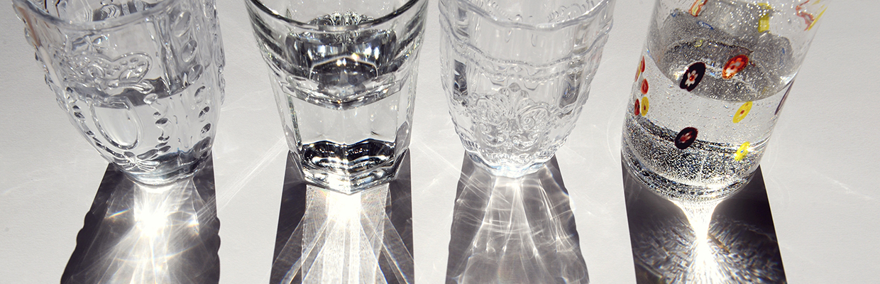 Four glasses reflecting daylight